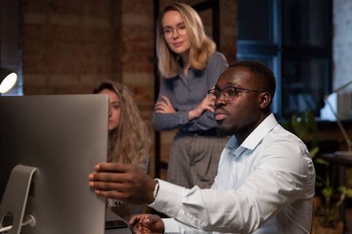 Focused web designers collaborating on attorney website development in Chicago